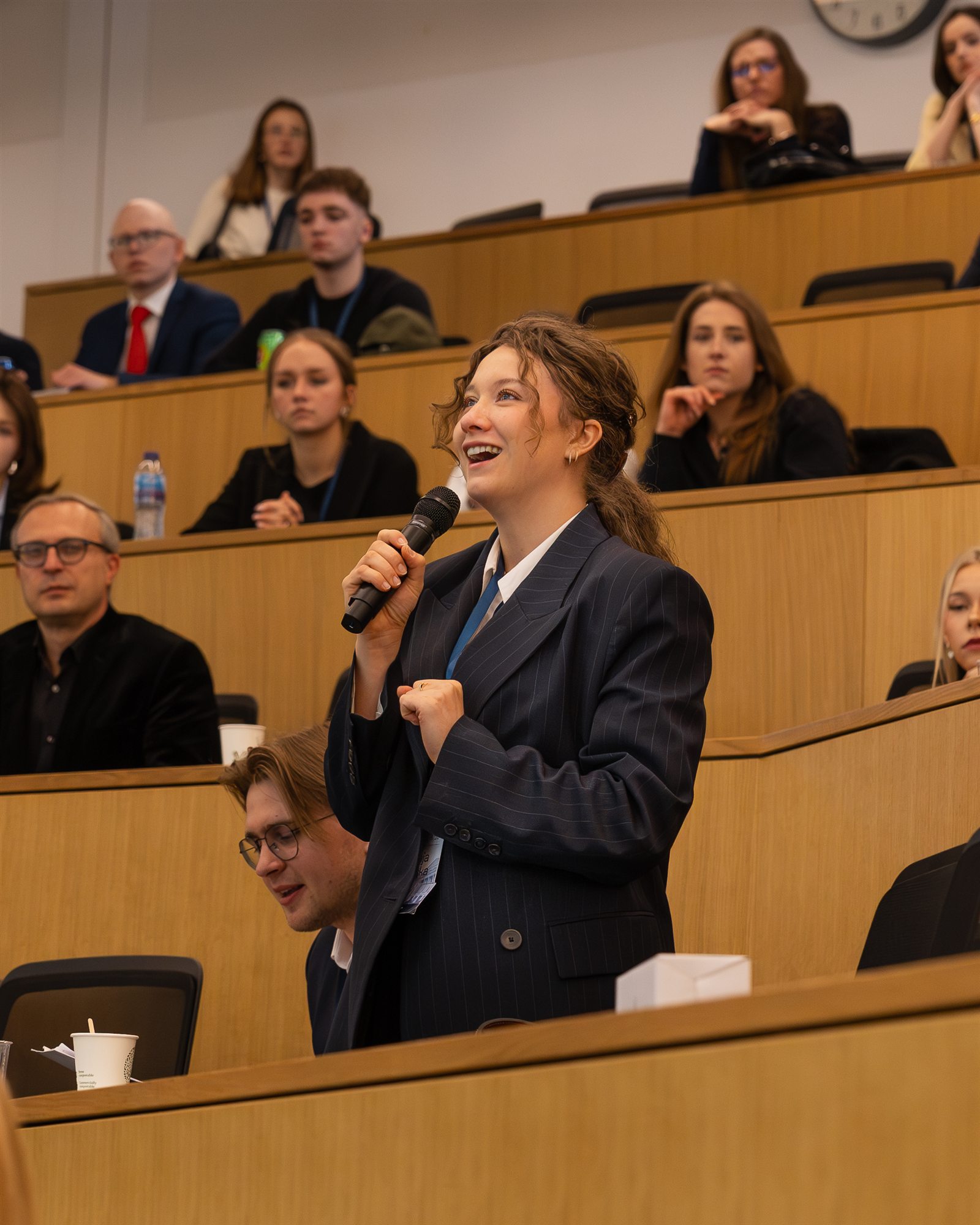 A speaker taking a question from the audience